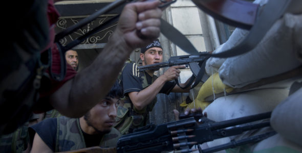 Combatants behind a barricade in Aleppo, Syria. (Ricardo Garcia Vilanova/ICRC, 2012)