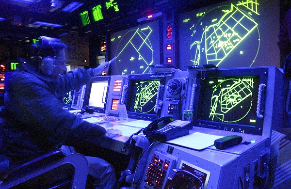 Tactical Action Officer in the Combat Direction Center of the aircraft carrier USS Harry S. Truman (CVN 75) as the ship conducts carrier qualifications in the Atlantic Ocean on Aug. 29, 2000. US Navy