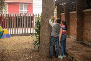 Kids, taking part in ICRC’s programme to assist the families of missing persons, hang messages on a tree for their missing relatives in Jalisco, Guadalajara, Mexico. Credit: Brenda Islas