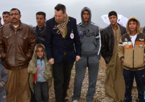 During a January 2015 visit, Mr. Maurer (pictured wearing an ICRC badge) said he heard "heartbreaking stories" from people displaced by fighting in Iraq. ©ICRC, S. Dabbakeh